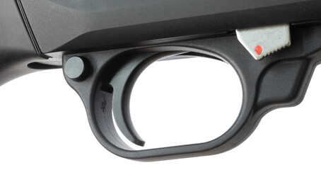 Angled view of the trigger, safety, trigger guard and action release on a shiotgun