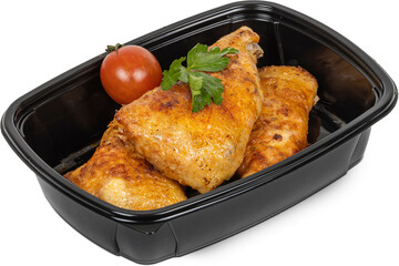 A black plastic container that is completely filled with chicken and tomatoes