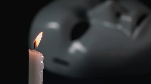 Burning candle fire and mystique mask

