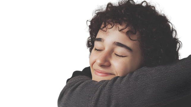 A young man with curly hair embraces his head, conveying a sense of contemplation or emotional reflection