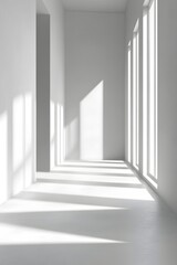 Fototapeta premium Bright white empty room with sunlight shining through windows creating shadows on the floor