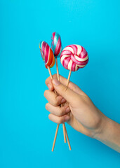 Color lollipop, spiral candy on stick, colorful striped lollypop, round fruit caramel, circle lollipop
