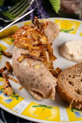 Fried white sausage with onion.