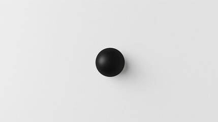 A single black dot on a white background