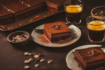 Delicious homemade French sugar free chocolate layered cake with cup of expresso