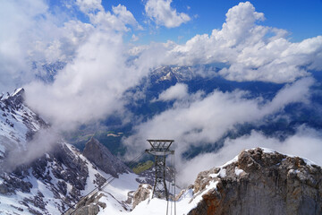 Snowy view of the summit of the Zugspitze, the highest mountain top in Germany in the Bavarian Alps region, in summer