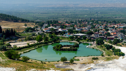 Fototapeta premium Mineral heart shaped lake or pond in Pamukkale village or cotton castle, Denizli Province, Turkey