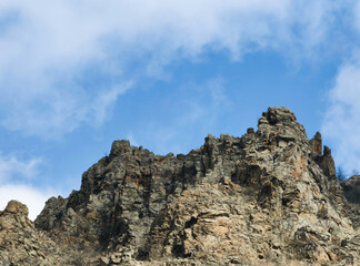 Ancient Fortress Cliffs Under Cloudy Sky