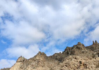 Ancient Fortress Cliffs Under Cloudy Sky