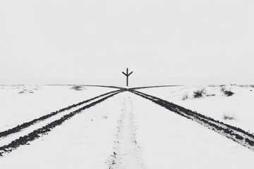 Snowy crossroads in winter landscape