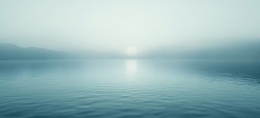 Obraz premium Serene Misty Lake Sunrise Peaceful Nature Scene Calm Water fog sky blue teal view mood