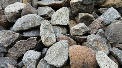 Close up of rough stones arranged randomly in the background. background concept.