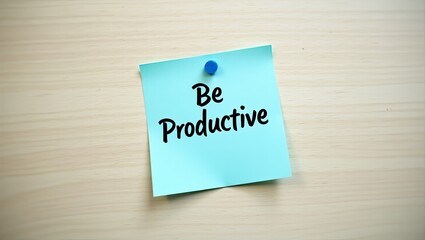 Be productive message, blue sticky note on table, motivational handwritten quotes	