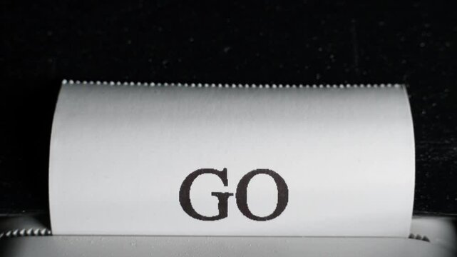 The receipt has the words "GO GREEN" printed in close-up. Large thermal print