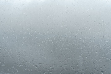 Raindrops on window glass. Rainy weather.