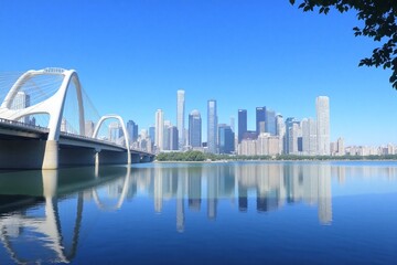 Obraz premium Landscape city skyline bridge over body of water clear blue sky buildings