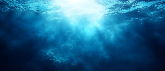 Fototapeta premium Sunbeams in deep ocean; underwater scene