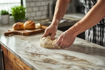 Male preparing dough on kitchen counter with fresh bread in background
