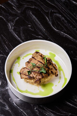 Deliciously Grilled Chicken Infused with Fresh Herbs Presented on a Minimalist Plate Design