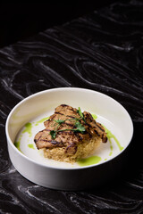 Deliciously Grilled Chicken Infused with Fresh Herbs Presented on a Minimalist Plate Design