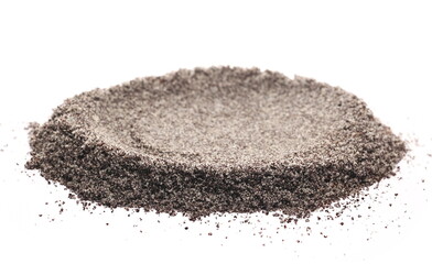 Ground poppy seeds pile isolated on white background, macro and side view