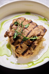 Deliciously Grilled Chicken Infused with Fresh Herbs Presented on a Minimalist Plate Design