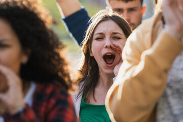 Young Woman Shouting at Social Justice Protest in Urban Environmen