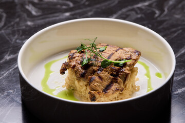 Deliciously Grilled Chicken Infused with Fresh Herbs Presented on a Minimalist Plate Design