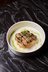 Deliciously Grilled Chicken Infused with Fresh Herbs Presented on a Minimalist Plate Design