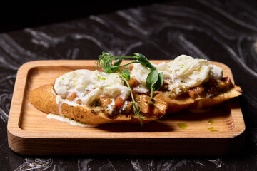 A Mouthwateringly Delicious Gourmet Dish Impeccably Served on a Rustic Wooden Plate
