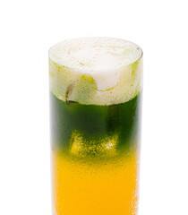 Refreshing layered drink with vibrant colors served in a tall glass