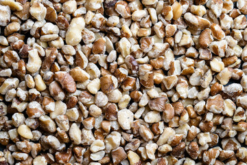 Black walnut pieces spread out, close-up from above.