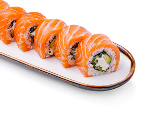 Fresh salmon sushi rolls arranged beautifully on a plate