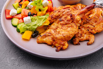 Grilled chicken leg quarter with fresh salad