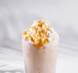 Caramel frappuccino drizzled with caramel sauce topped with whipped cream