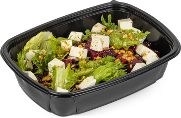 A fresh salad served in a black plastic container against a white background