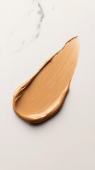 Fototapeta premium A vertical shot of a thick beige liquid foundation swatch, artistically arranged on a sleek, dark marble surface. 