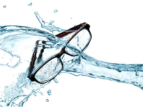 Black plastic eyeglasses water splash on white background, studio shot