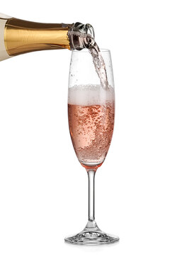 Rose champagne pouring in a flute glass on white background, studio shot