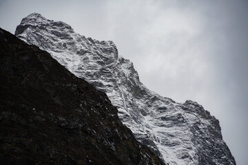 Majestic mountain summit high altitude range nature photography cloudy sky close-up view adventure concept