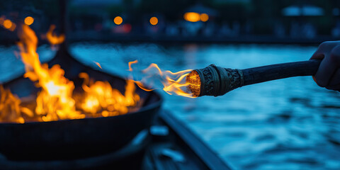 Flaming Torch and Brazier by Water at Dusk