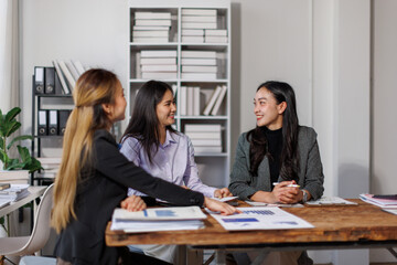 Business adviser meeting to analyze and discuss the situation on the financial report in the Asian meeting room.Investment Consultant, Financial advisor and accounting concept
