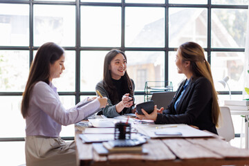 Fototapeta premium Business adviser meeting to analyze and discuss the situation on the financial report in the Asian meeting room.Investment Consultant, Financial advisor and accounting concept 