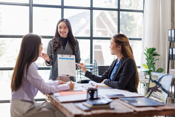 Business adviser meeting to analyze and discuss the situation on the financial report in the Asian meeting room.Investment Consultant, Financial advisor and accounting concept
