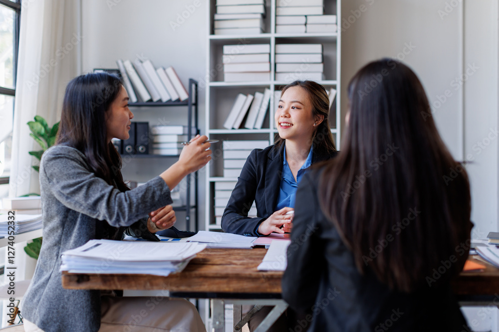 Wall mural Business adviser meeting to analyze and discuss the situation on the financial report in the Asian meeting room.Investment Consultant, Financial advisor and accounting concept
