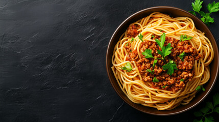 bowl of spaghetti topped with rich bolognese sauce and fresh herbs