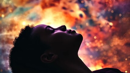 Silhouette of African child lying under stars and galaxies in her dream. Fortune telling, cartomancy, astrology and dream concept video background.