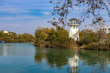 Lighthouse on the bank of Manavgat River on a sunny autumn day. Manavgat, Antalya province, Turkey