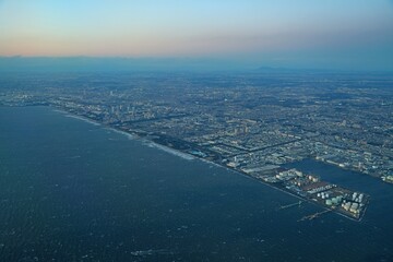 Aerial view of the Tokyo Bay, Japan, at nightfall in approach at Haneda Airport
