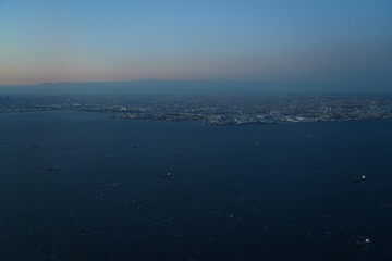 Aerial view of the Tokyo Bay, Japan, at nightfall in approach at Haneda Airport